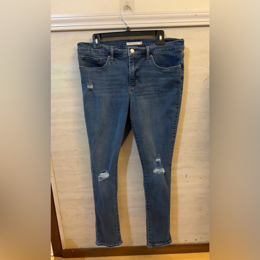Levi's 311 Shaping Skinny Distressed Jeans.